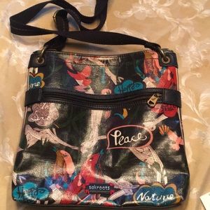 Sakroots black and nature-themed purse